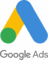 Google Ads logo featuring a blue and yellow stylized "A" shape with a green circle at the bottom, and the text "Google Ads" below it.